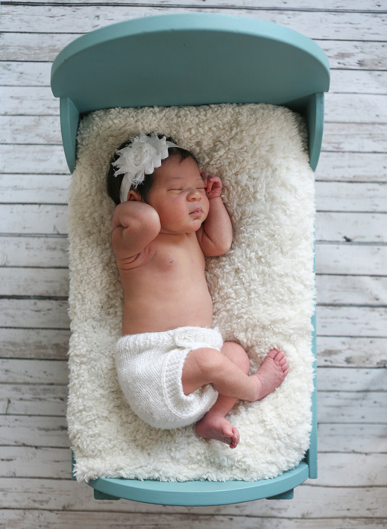 Newborn Baby In Doll Bed