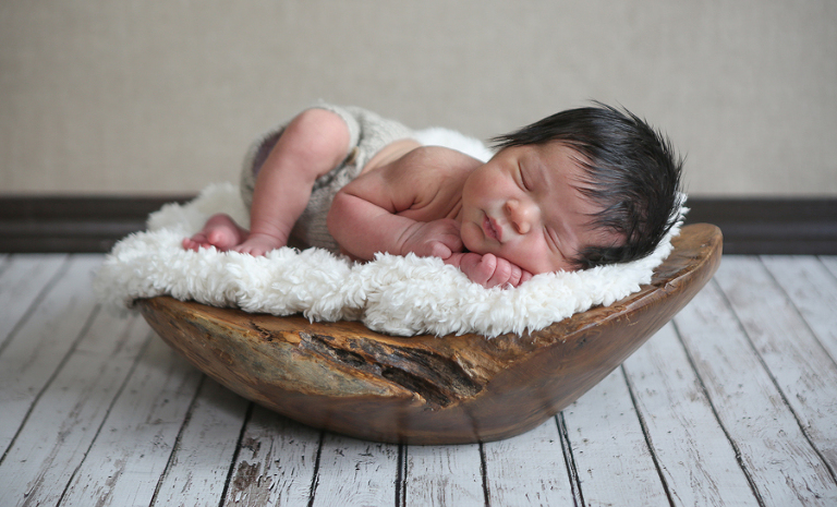 Newborn Baby In Wood Bowl