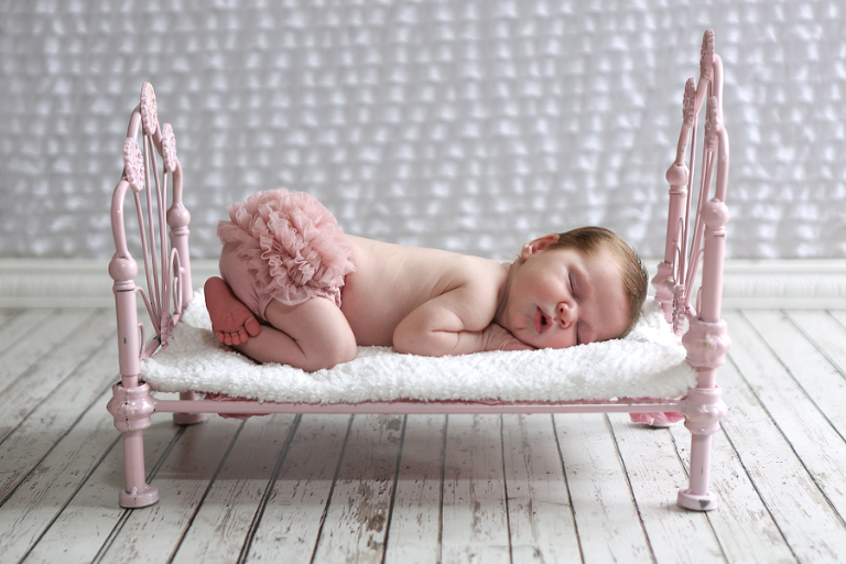 Newborn Baby On Iron Doll Bed
