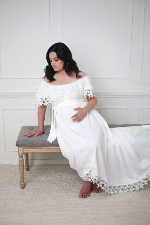 Los Angeles Studio Maternity session, white molding wall, pregnancy mother in white dress. 