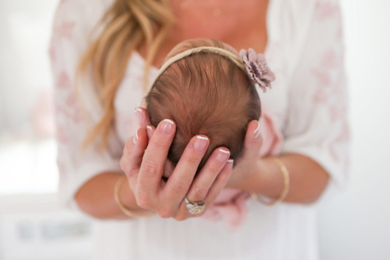 Newborn Baby Photography Session, Mom holding newborn in her hands, Newborn Photography Los Angeles
