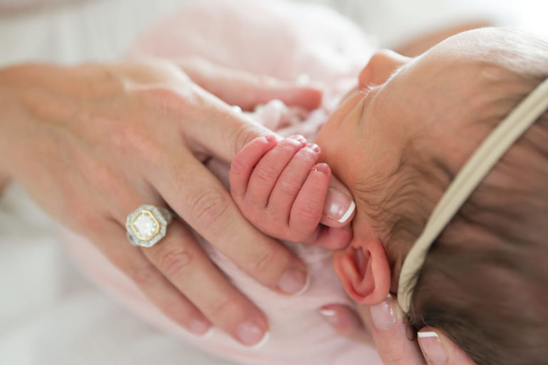 Newborn Baby Photography Session, Mom holding newborn in her hands, Newborn Photography Los Angeles