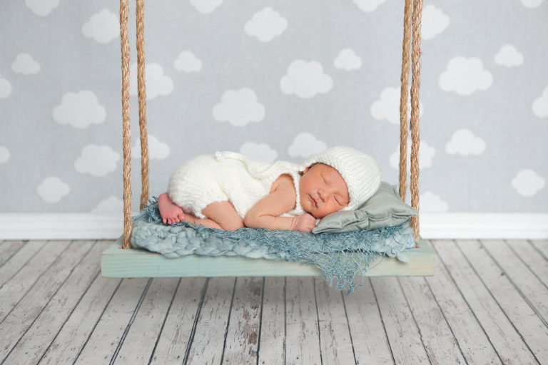 Glendora Newborn Baby Photography Session, Baby on Newborn Swing Prop, Cloud Background, Diana Henderson Photography